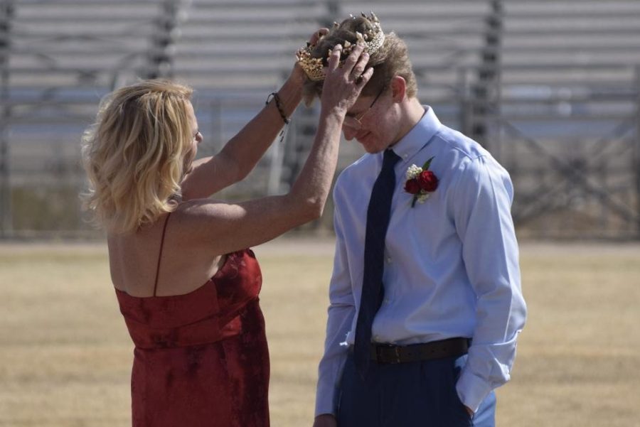 King of Hearts Rudy Richards receives the coveted crown from his mother during the Feb. 27 coronation.