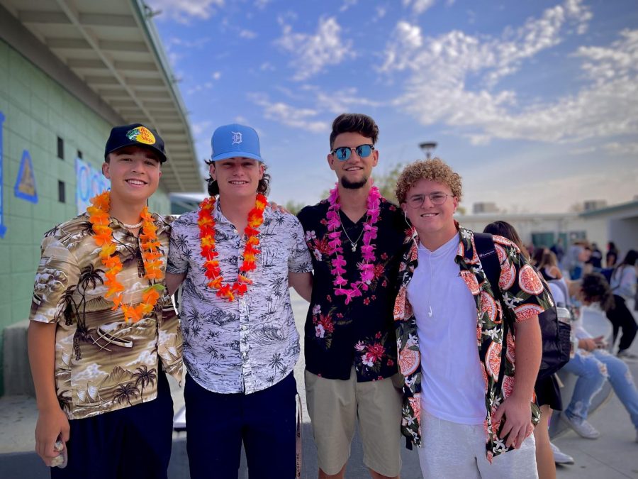 (From left) Seniors Robby Lusher, Conner Batzer, and Michael Farris join Junior Devon Segovia in dressing up for Aloha Day.