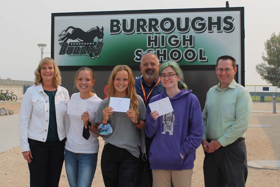 Principal Carrie Cope and Counselors Dave Vigneault and John Hill congratulate (from left) Madison Johnson, Megan Small and Isabel Kidner. 