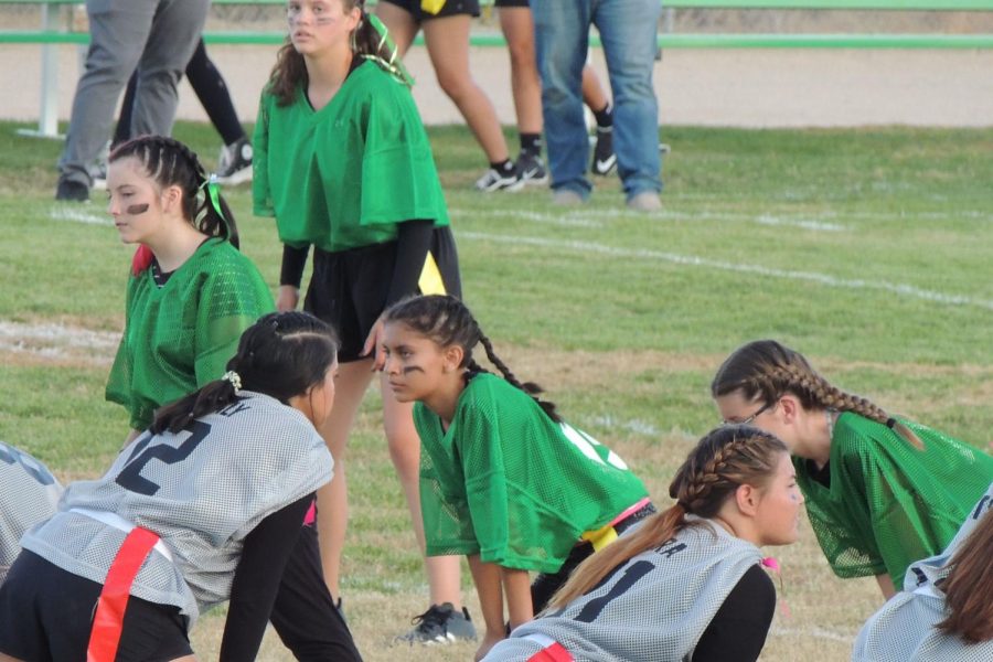 Sasha Silva (green) faces off against her junior competition during Wednesdays Powderpuff competition. 