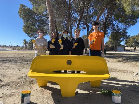 Juniors Leilani Berry, Nathaly Flores, Kristy Shao, Linda Moreno and Alexander Vargas finish painting a bench at Leroy Jackson Park.
