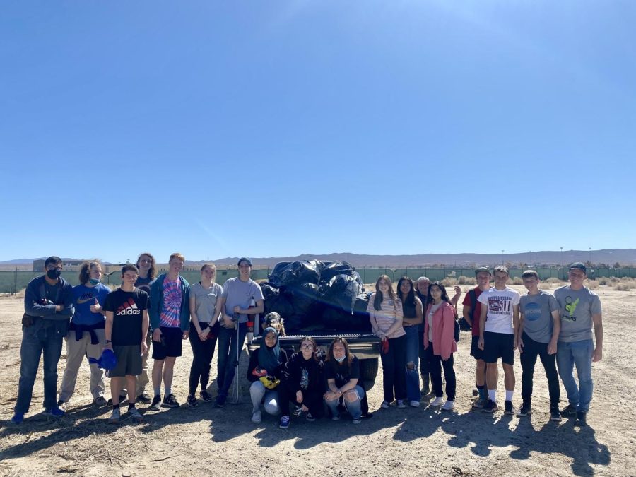 Interact Club members collect a truck-load of trash after their road clean-up. 