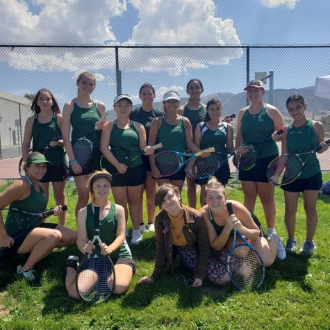The Burroughs tennis team is all smiles after their Aug. 25 win against Tehachapi. 