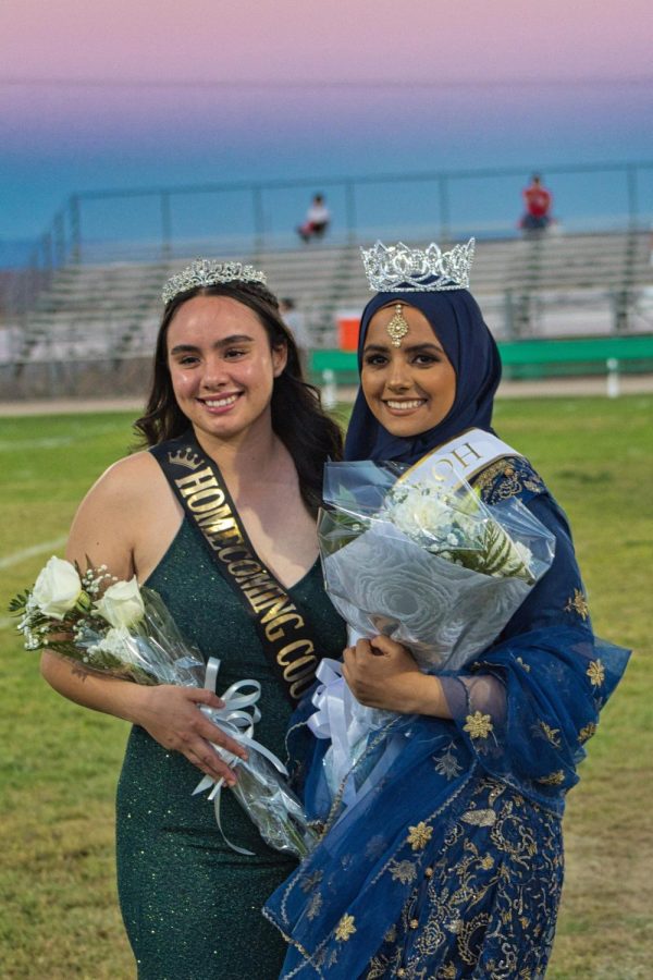 Last years top 3 candidate Brooke Luevano shares in Mahnoor Ahmads excitement at being crowned Homecoming Queen.