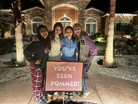 BHS cheerleaders (from left) Julissa Martinez, Olivia Haas, Destiny Homstad-Long, and Paige Dunn spread some cheer at the Ahmad household. 