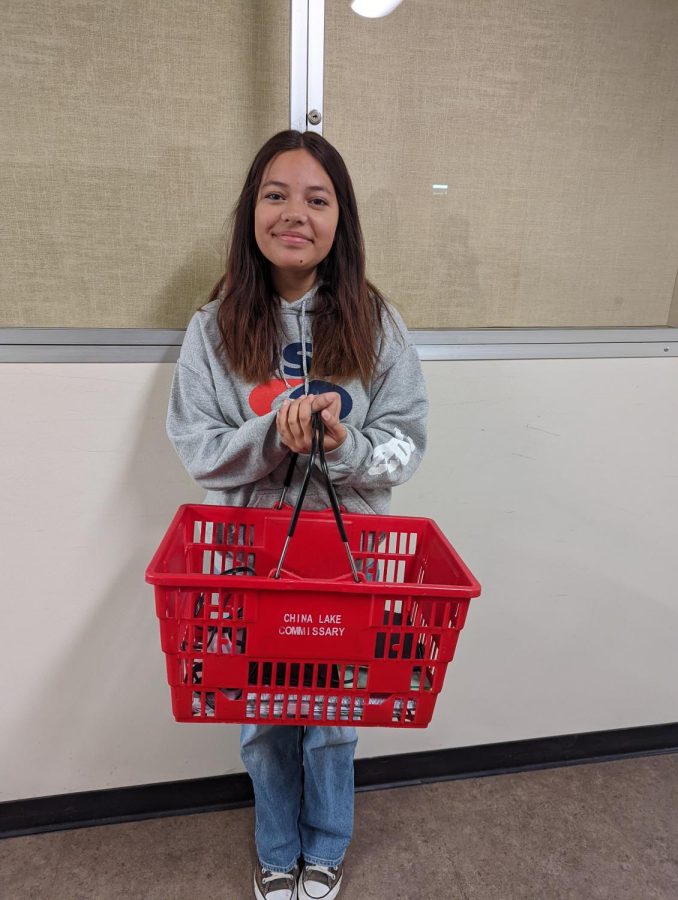 Freshman Marlee Hildreth uses a China Lake Commissary basket as her bag for Anything But a Backpack Day.