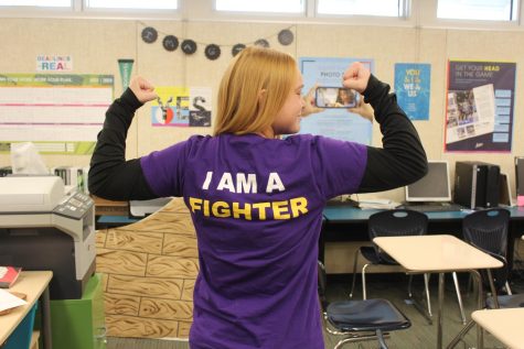 Sophomore Isabella Frisbee promotes cystic fibrosis awareness on the Nov. 4 Whats Your Cause? spirit day. 