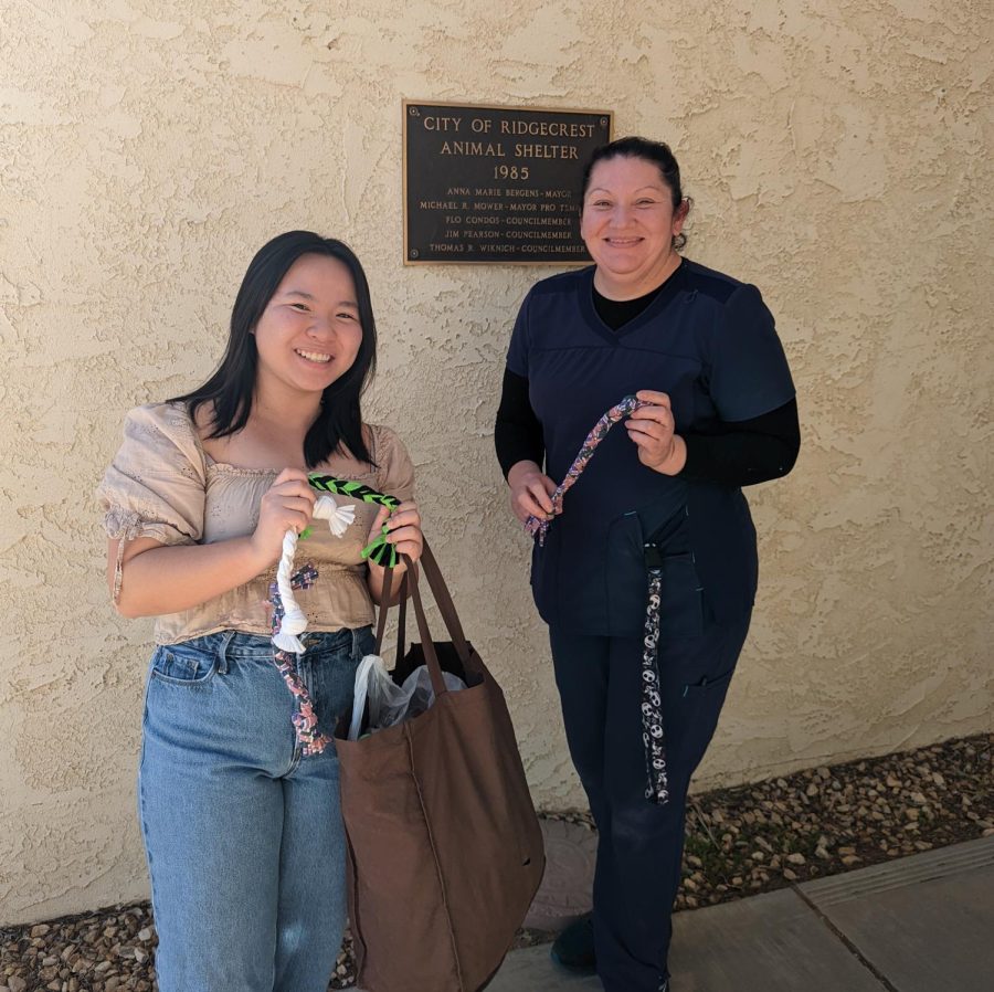 Key Club president Amanda Ngo hands off club-made dog toys to our local animal shelter.