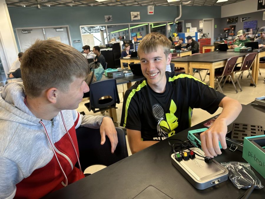 Juniors Digby Anderson and Trevor Carter test sensors and outpouts on the Pi top in their Digital Electronics class.