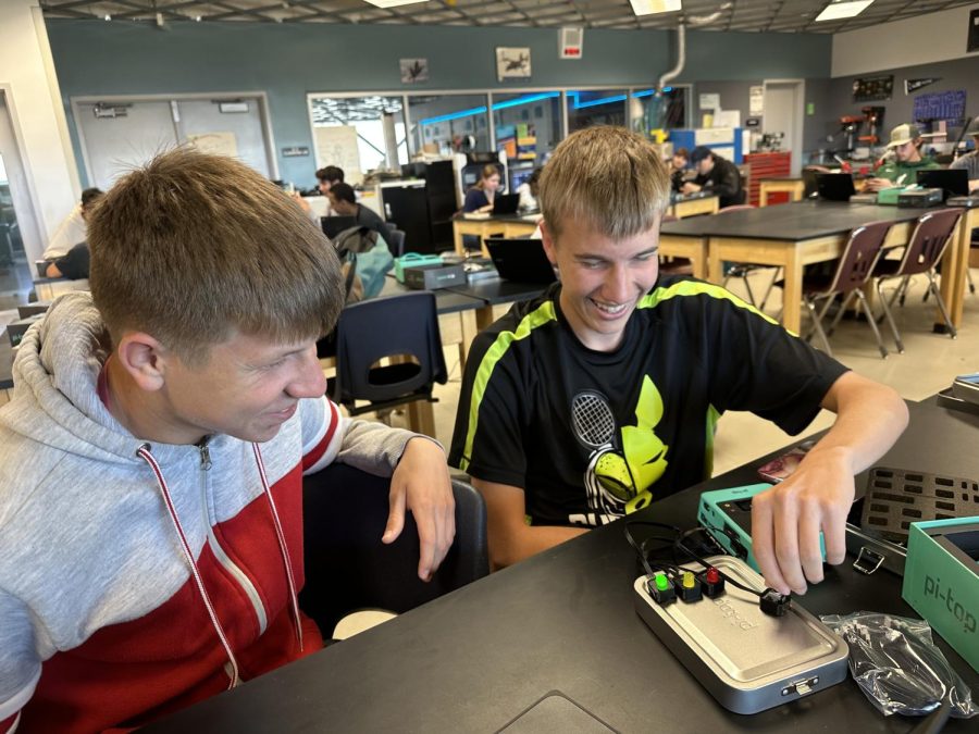 Juniors Digby Anderson and Trevor Carter test sensors and outpouts on the Pi top in their Digital Electronics class.