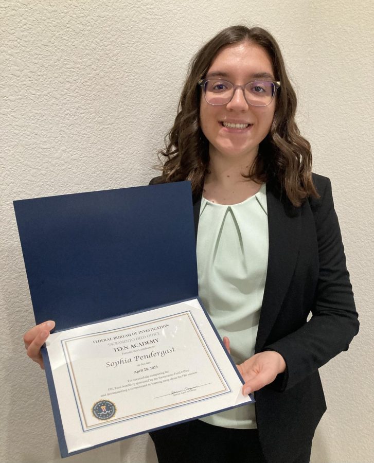 Junior Sophia Pendergast proudly shows off her FBI certificate! 