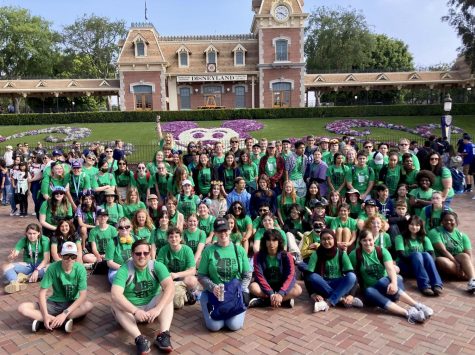 Burroughs Music Teachers Brian Cosner and Amber Petersen (front, center left) jgather with their collective groups at Disneyland following their World Strides Performing Arts Festival performances. 