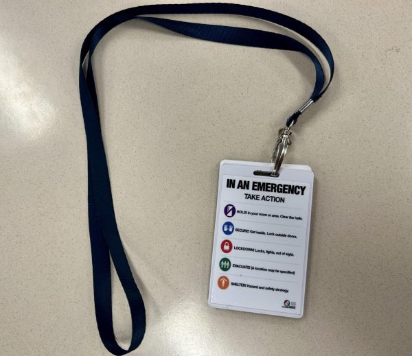 Burroughs personnel are each given a lanyard with the new safetry infomation.