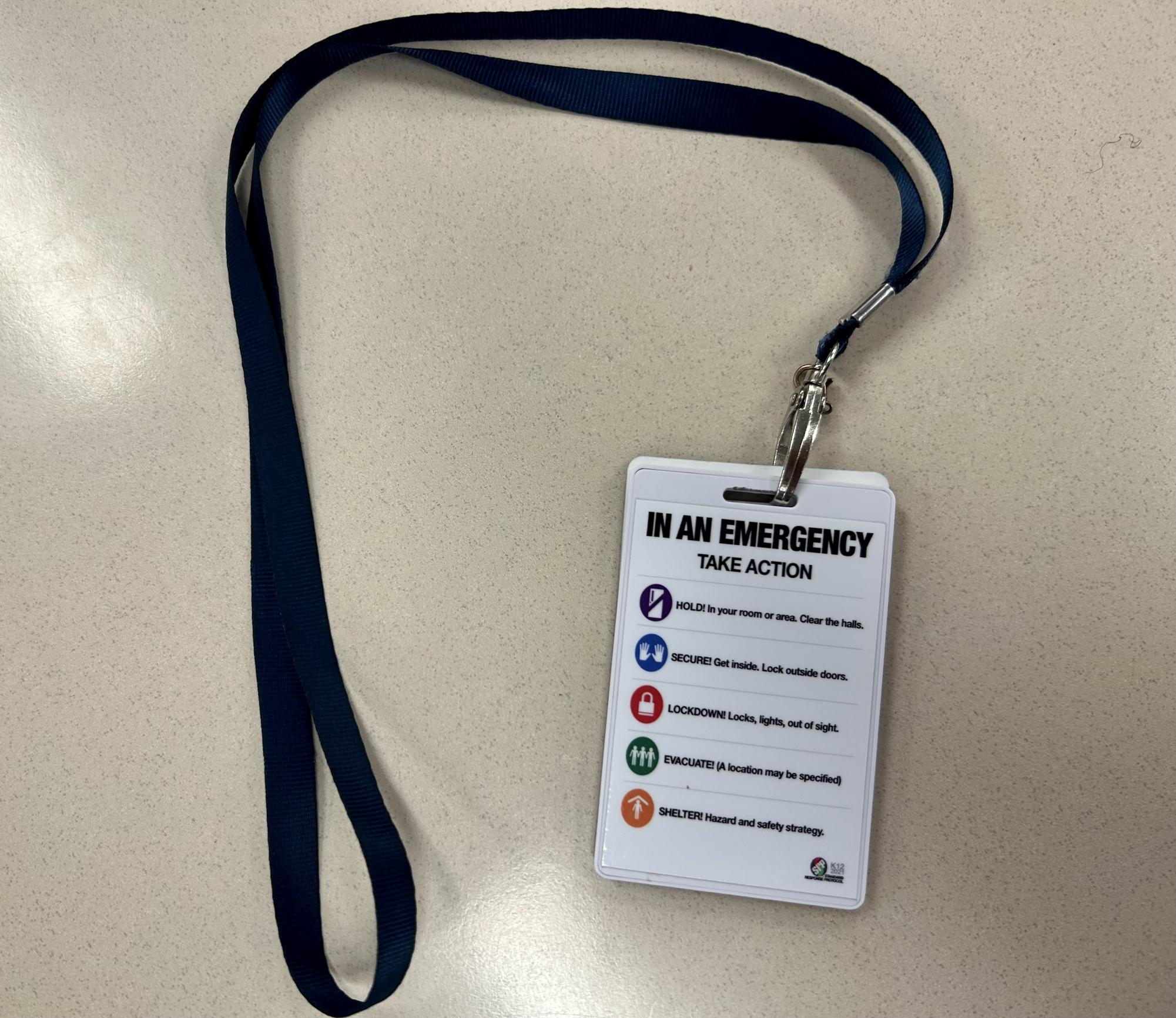 Burroughs personnel are each given a lanyard with the new safetry infomation.