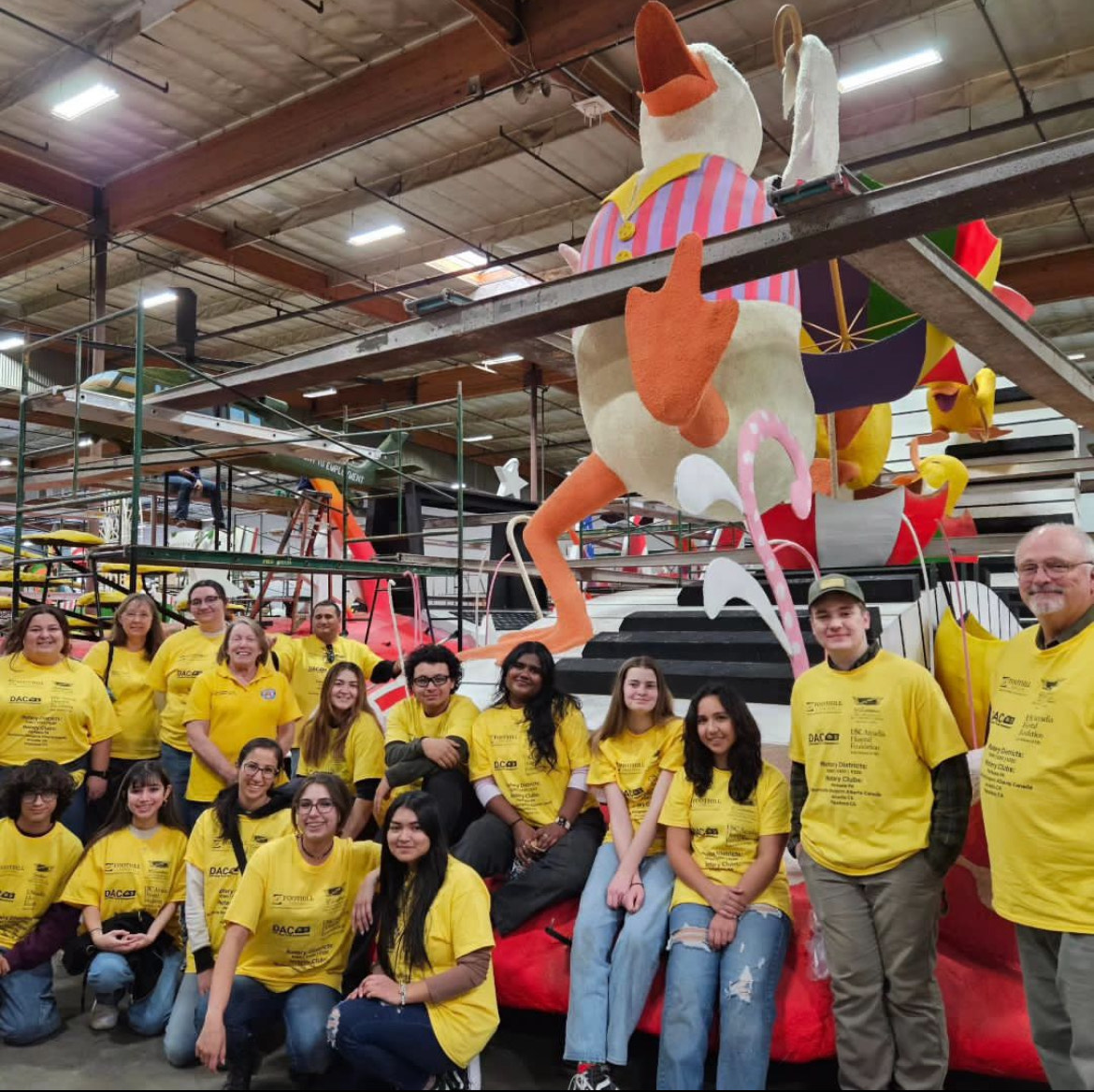 Burroughs Interact Club members, along with Rotarians and other Interactors, pose with the Rotary Rose Parade float that they helped create.