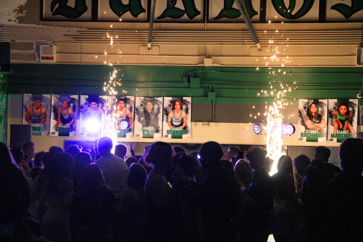 Students fill the dance floor at Saturday’s King of Hearts dance, which featured cold sparks special effects to mimic a pyrotechnic display in keeping with the “Night under a 1,000 Lights” theme. 