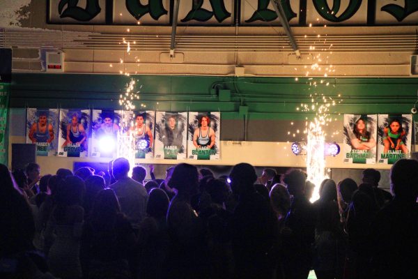 Students fill the dance floor at Saturday’s King of Hearts dance, which featured cold sparks special effects to mimic a pyrotechnic display in keeping with the “Night under a 1,000 Lights” theme. 