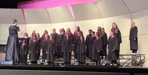 Concert Choir and Madrigals perform as Amber Petersen conducts them.