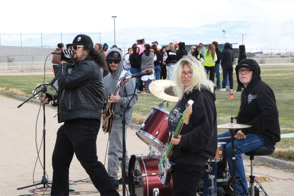 Sasha Hamaker (guitar) and Brett Hiatt (drums) play during the Spring Rally.