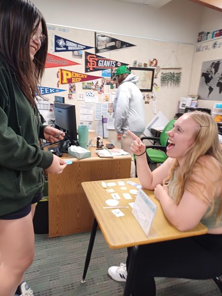 Sophomore Tamanh Nguyen (left) negotiates with Sophomore Trinity Hoffman (right) at her port city 