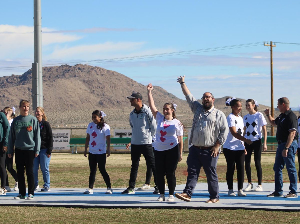 Now-Assistant Principal Elijah Colpitts (center right) joins Principal Carrie Cope (left) and Assistant Principal Chris Ostermann (right) and the BHS cheerleaders during last year's faculty performance during the Winter Rally.