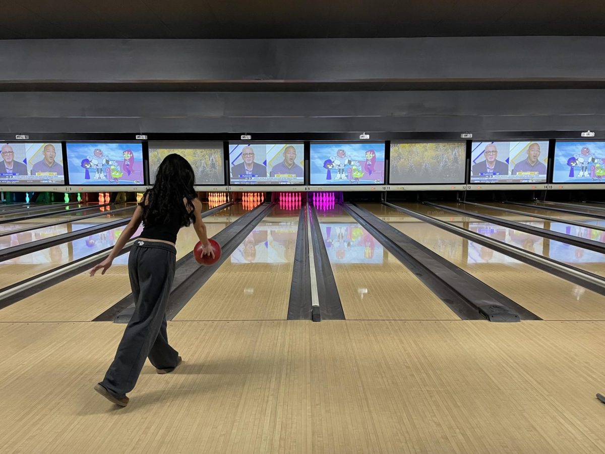 Senior Julia Hechanova makes her move at the reopened bowling alley. 