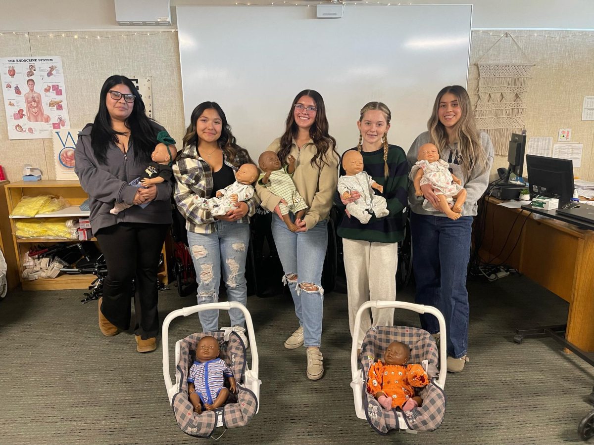 Students milly Cazares Bogarin, Josie Perez, McKayLynn Zissos Baird, Chloe Johnson, and Yasmine Flores have their hands full with their "Ready or Not" infant simulators. 