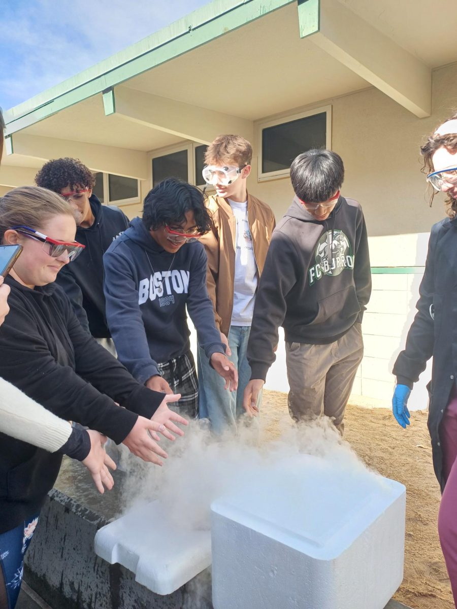 Sophomores Jessica Ford, Jayshion Bostick, Oscar Moreno, Ryan Carter, and Justin Lee feel their hands against the explosion. 