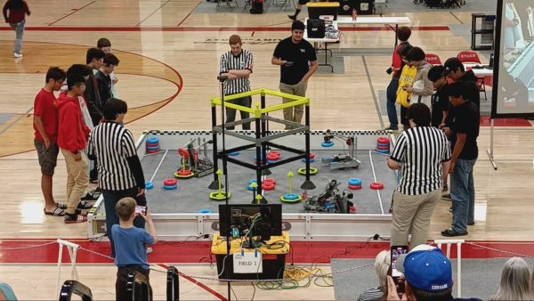 Team 7422B expertly controls their robot to score rings to win their match