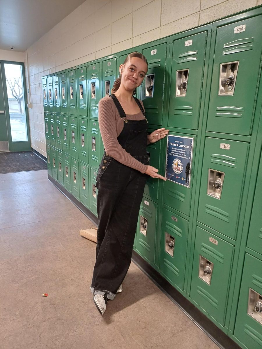 Sophomore Maddy Hocker invites students to send requests to the C-Hall prayer locker. 