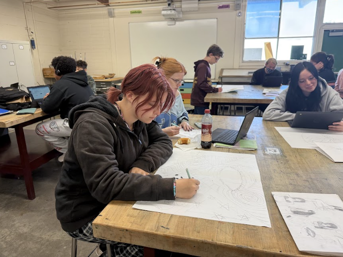 Freshman Norah Goodman brings out her artistic vision while sketching out her Element of Arts Project. 