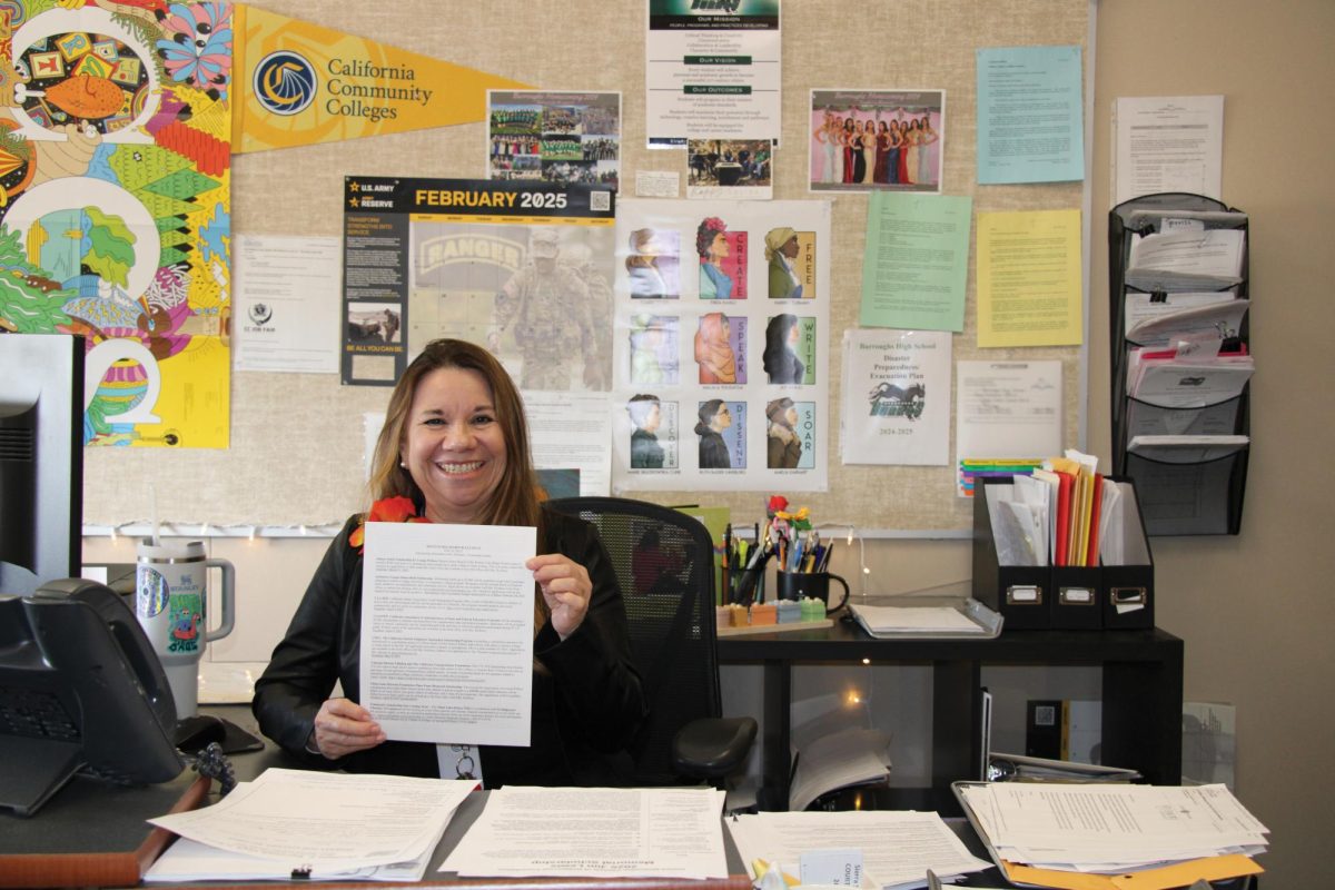 Counseling Center Clerk Laurie Rolfness is ready to help students find their fit on the scholarship bulletin.