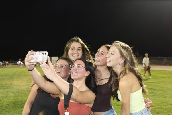 (Clockwise from upper left) Audrey Robesky, Lillah O'Grady, Bella Basham, McKayLynn Baird, and Kaitlyn Willis capture the first of many senior year memories at this year's Kickback.