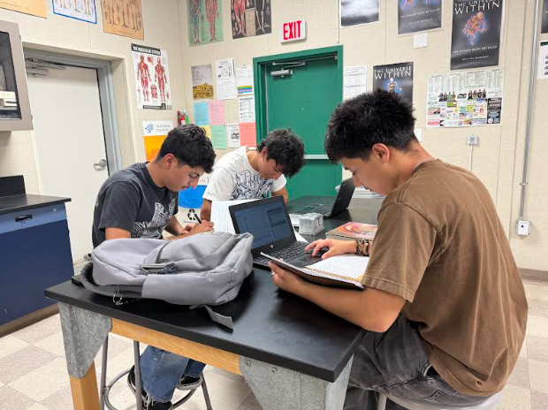 Nicolas Ramsay,  Michael Munoz, and Miguel Guerrero work on assignments at lunch in the Academic Learning Lounge.