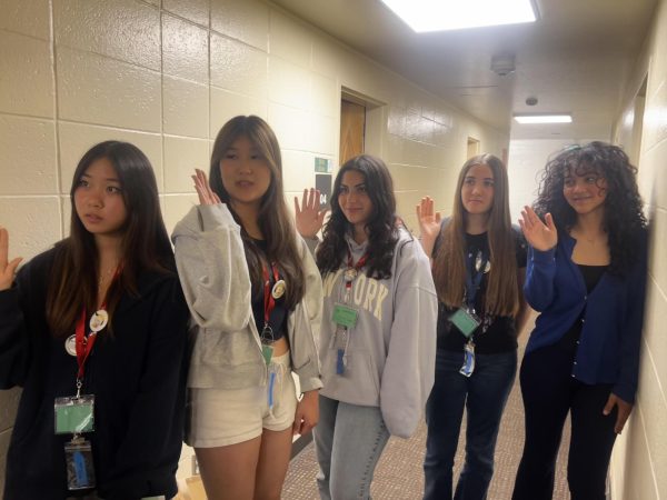 Senior Angelina Placencia (second from right) swears in as a city council member.
