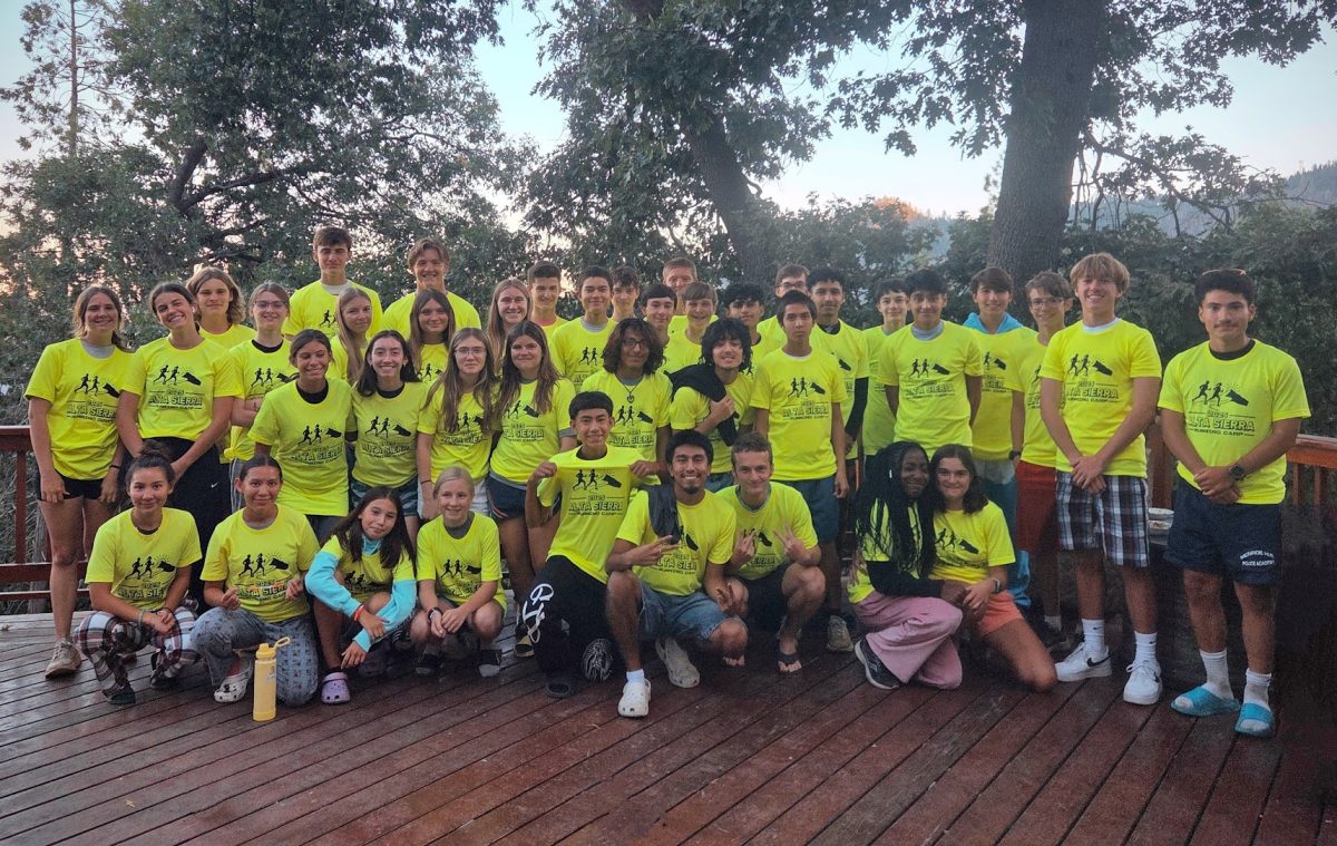 The team receives their running camp shirts!