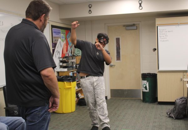 Criminal justice students test drunk driving goggles in a sobering lesson