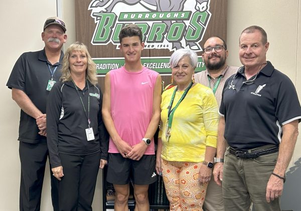 Dean of Students Doug Hayes, Principal Carrie Cope, senior Silas Arberer, Counselor Rose Douglas, Asst. Principal Elijah Colpitts, and Asst. Principal Chris Ostermann celebrate Arberer's recognition as a National Merit Semi-Finalist.