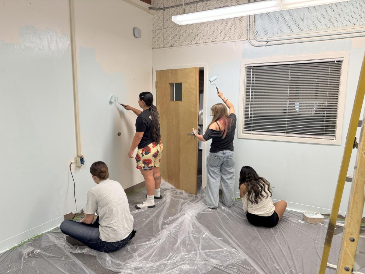 AVID students Abby Hardwick, Katey Bailey, Haileyana Garcia, and Abby Hernandez spread a calming blue paint on the walls of the new Wellness Room. 