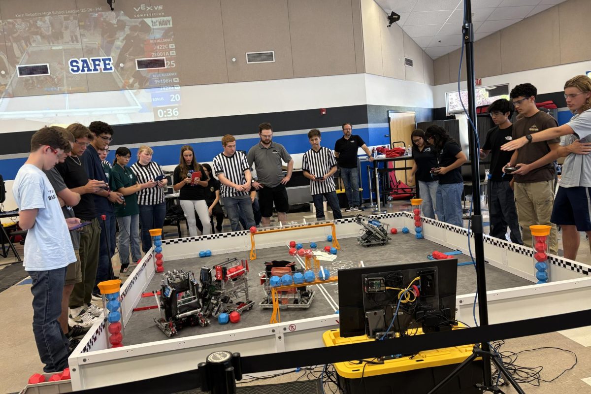 Robotics teams 7442S and 7442C compete against each other with their alliance partners at their first competition of the season. The mixed-grade team won.