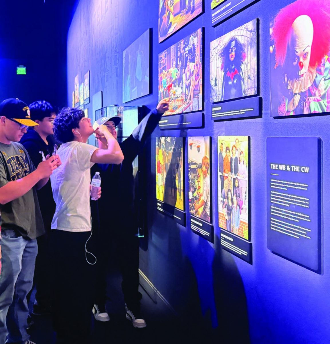 Senior John Bienkowski, junior Mike Ochoco, junior Samuel Grajeda, and senior Dominic Woods check out the displays during the Warner Bros. Studios tour. 