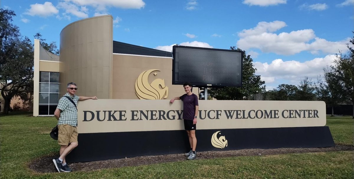 Burroughs High School senior Silas Aberer (right) stands with his father at the University of Central Florida. Aberer will attend the university this fall as a National Merit Finalist on a nearly full-cost scholarship.