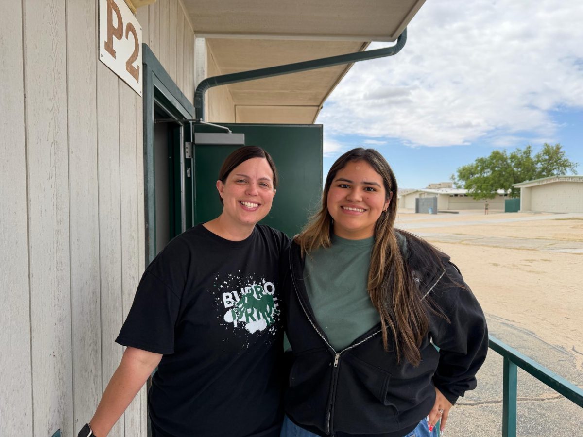 ASB Advisor Laura Larson (shown with senior Alli Garcia) is taking her Burro Pride back to Montana. 